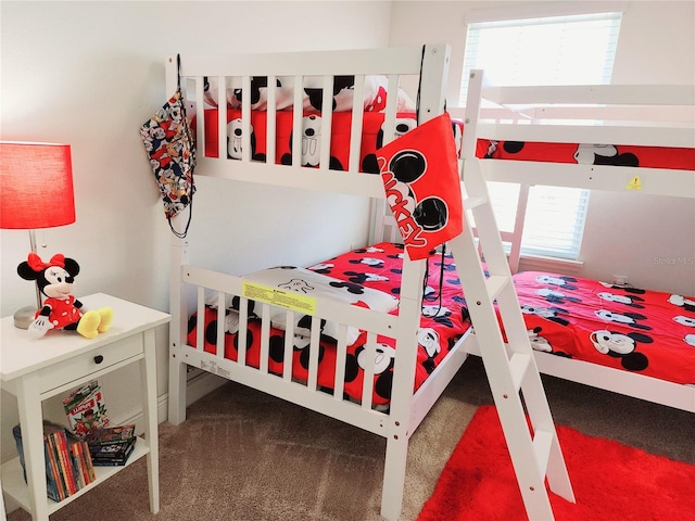 carpeted bedroom with multiple windows