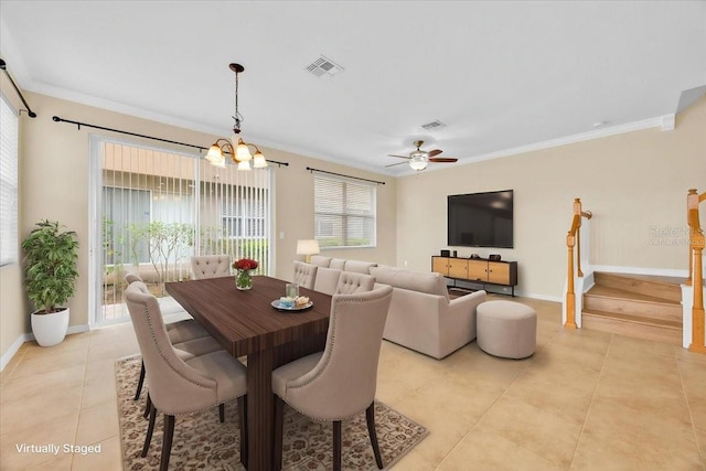 1518 Orrington Payne Pl, Casselberry, FL 32707 - dining space with light tile patterned floors, ceiling fan with notable chandelier, crown molding, visible vents, and baseboards