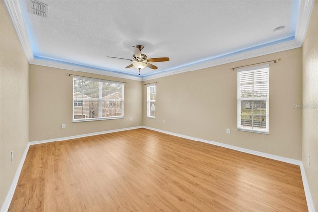 1518 Orrington Payne Pl, Casselberry, FL 32707 - spare room with a ceiling fan, a wealth of natural light, ornamental molding, and light wood finished floors