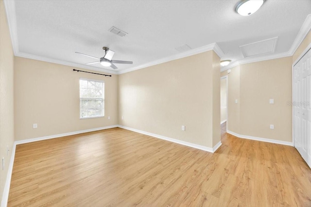 1518 Orrington Payne Pl, Casselberry, FL 32707 - unfurnished room featuring attic access, crown molding, visible vents, ceiling fan, and light wood-style floors