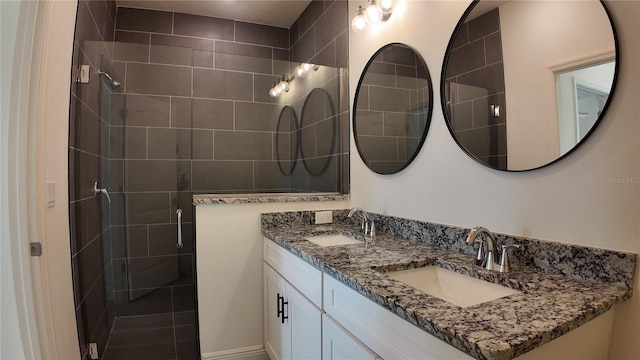 bathroom featuring vanity and a shower with shower door