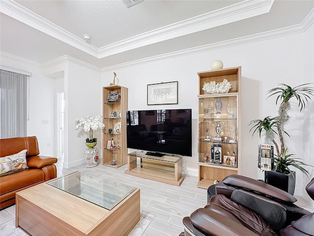 living room with light wood-type flooring, crown molding, and a textured ceiling