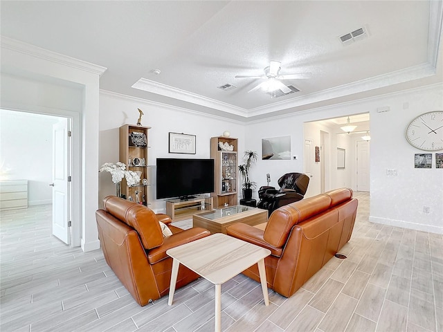 living room with crown molding and ceiling fan