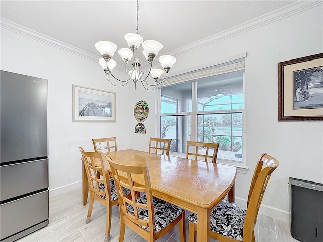 dining space featuring ornamental molding, light wood-type flooring, and a chandelier