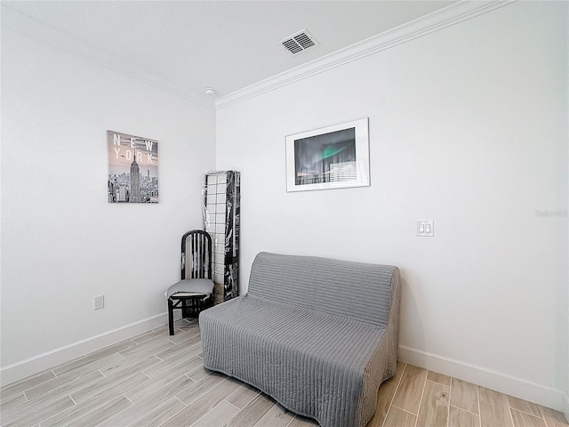 sitting room with ornamental molding