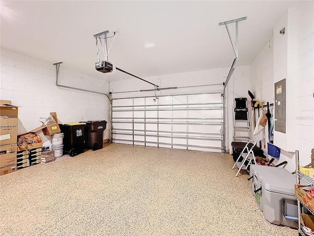 garage with electric panel and a garage door opener