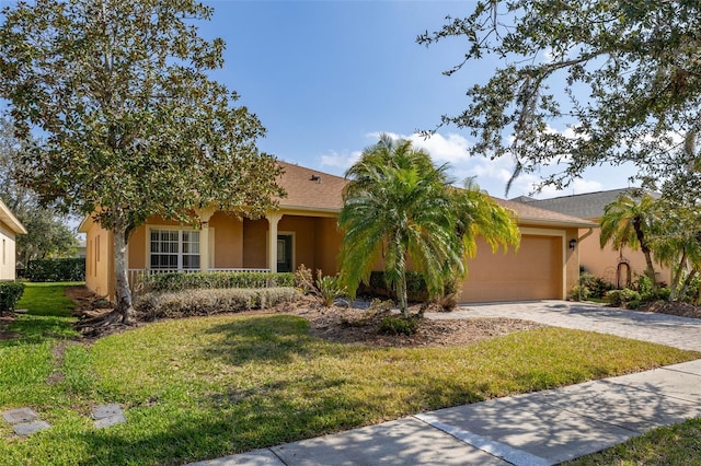 view of front of property with a front lawn and a garage