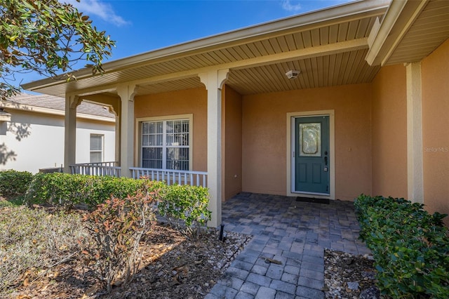 entrance to property with covered porch