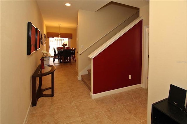 hall featuring recessed lighting, stairway, light tile patterned flooring, and baseboards