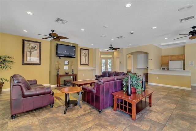 living room featuring ceiling fan