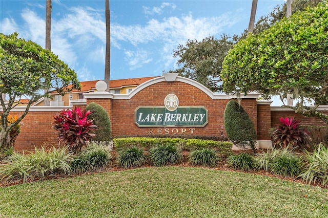 community / neighborhood sign with a lawn