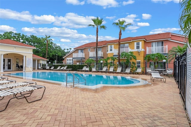 view of swimming pool with a patio area