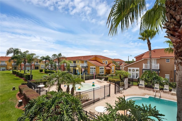 view of swimming pool featuring a patio and a lawn