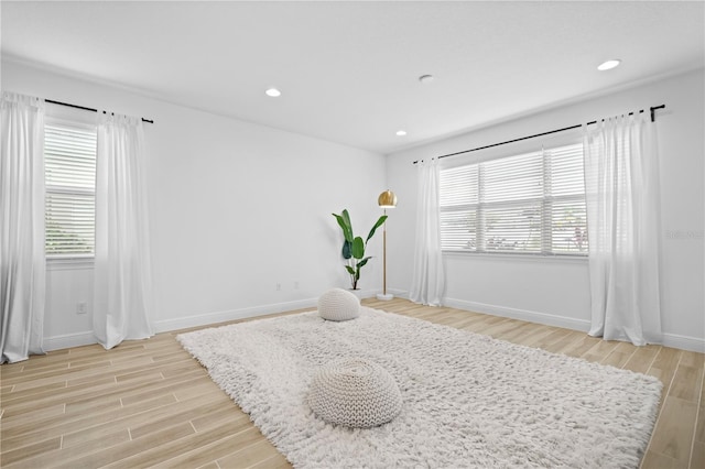 sitting room featuring recessed lighting, baseboards, and light wood-style flooring