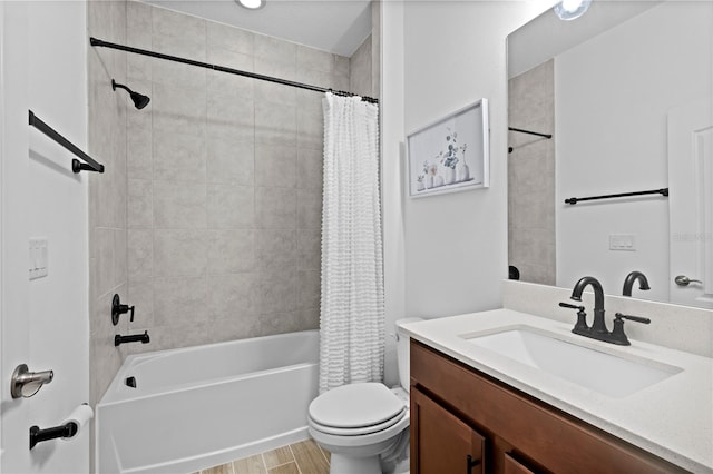 bathroom featuring vanity, toilet, wood finished floors, and shower / tub combo with curtain