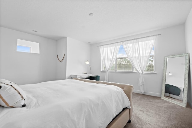 carpeted bedroom with baseboards