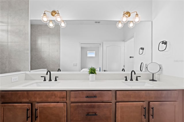 full bath featuring double vanity and a sink