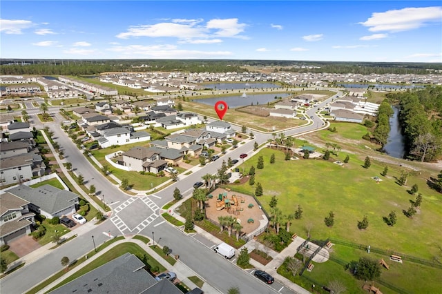 bird's eye view with a water view and a residential view