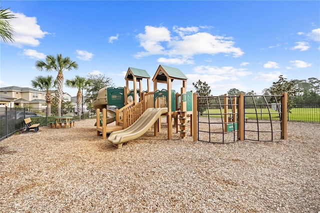 communal playground featuring fence