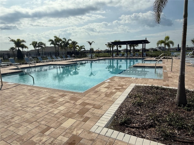 1892 Spring Shower Cir, Kissimmee, FL 34744 - community pool with a pergola and a patio area