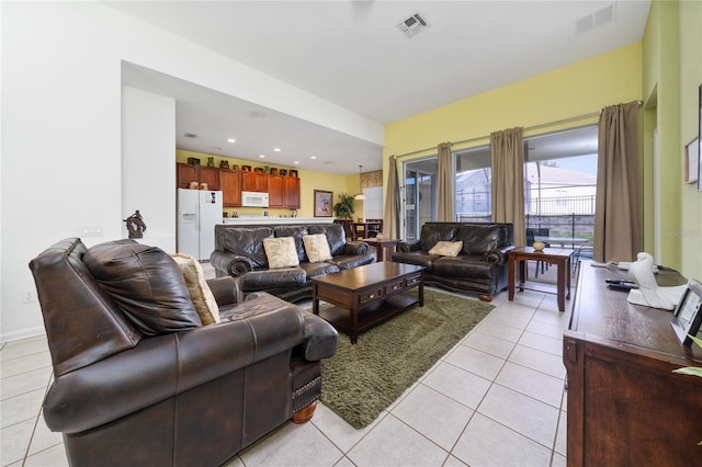 7735 Teascone Blvd, Kissimmee, FL 34747 - living area featuring light tile patterned floors and recessed lighting