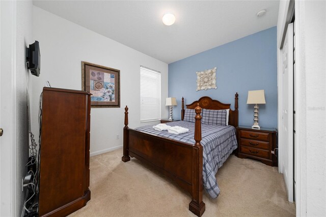 7735 Teascone Blvd, Kissimmee, FL 34747 - bedroom with light colored carpet and baseboards
