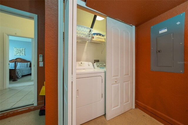 7735 Teascone Blvd, Kissimmee, FL 34747 - laundry area featuring electric panel, washer and dryer, and baseboards