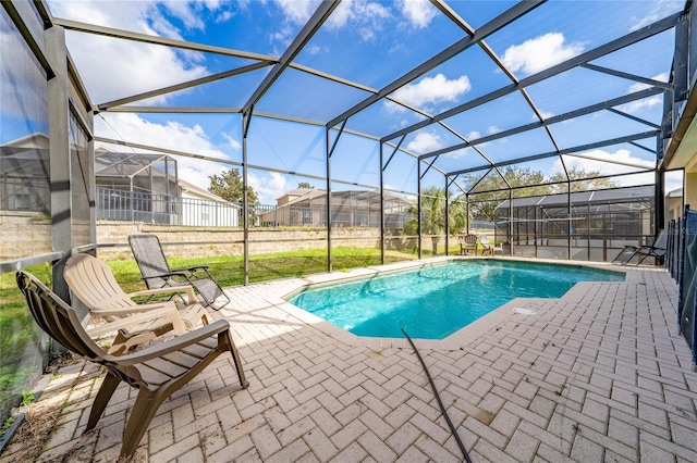 7735 Teascone Blvd, Kissimmee, FL 34747 - swimming pool with a patio and glass enclosure