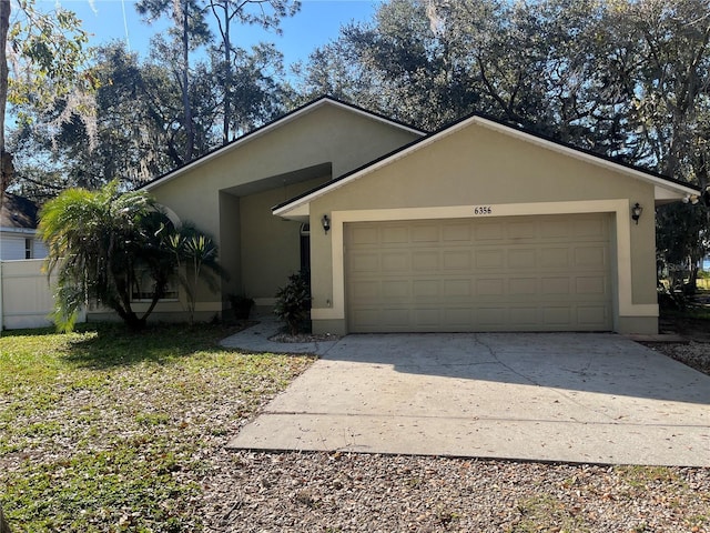 single story home with a garage