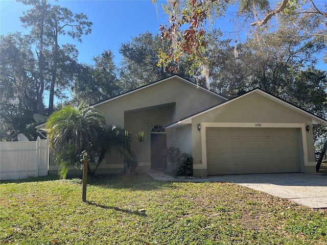 single story home featuring a garage and a front yard