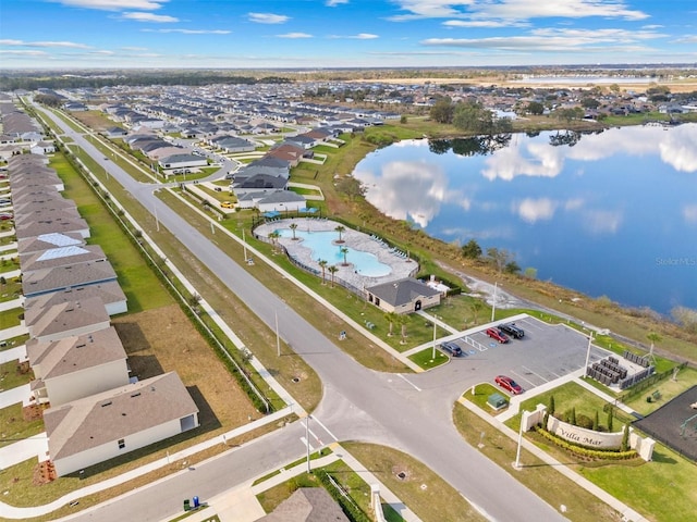 bird's eye view featuring a water view and a residential view