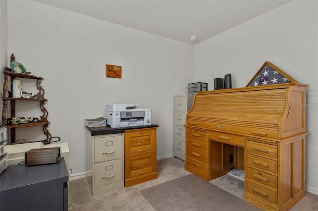 home office featuring light carpet and baseboards