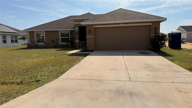 single story home featuring a garage, stucco siding, concrete driveway, and a front lawn