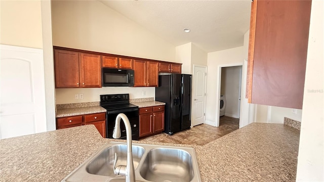 kitchen featuring black appliances, light countertops, washer / clothes dryer, high vaulted ceiling, and a sink