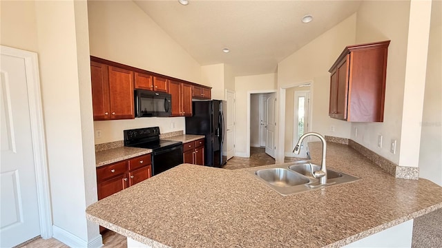 kitchen with high vaulted ceiling, a peninsula, recessed lighting, a sink, and black appliances