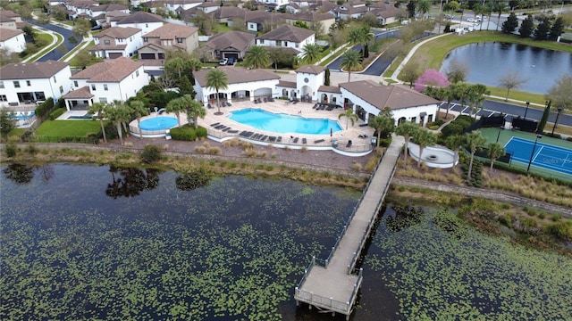 birds eye view of property featuring a water view and a residential view