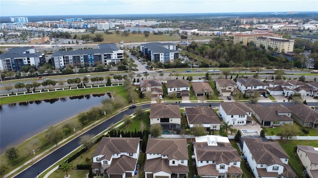 bird's eye view with a residential view and a water view