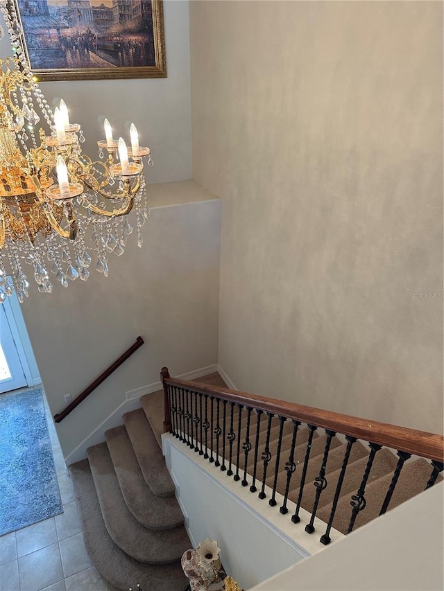 stairway with tile patterned floors