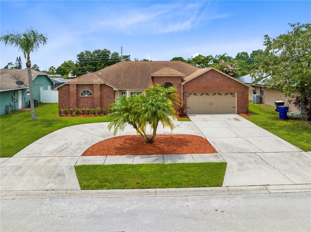 ranch-style house with a garage, central AC, and a front yard