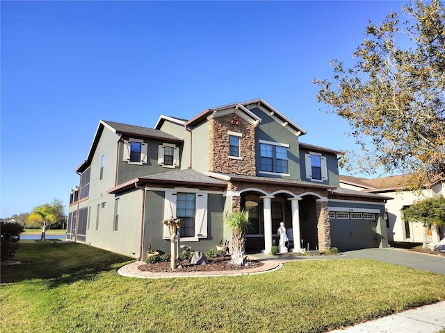 view of front of house featuring a garage and a front yard