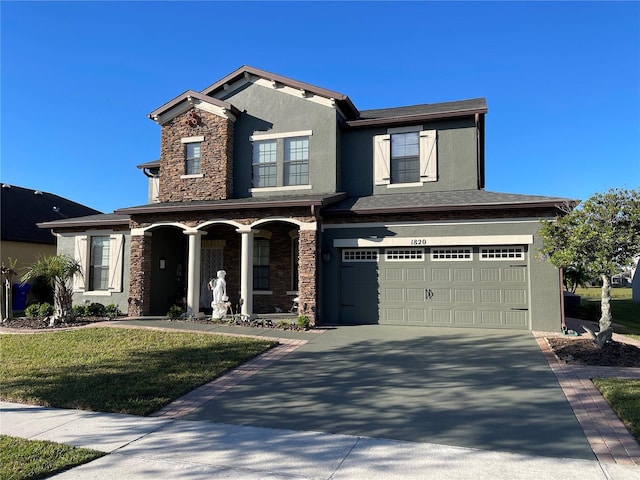 1820 Trophy Bass Way, Kissimmee, FL 34746 - craftsman-style home with an attached garage, a porch, stucco siding, stone siding, and driveway