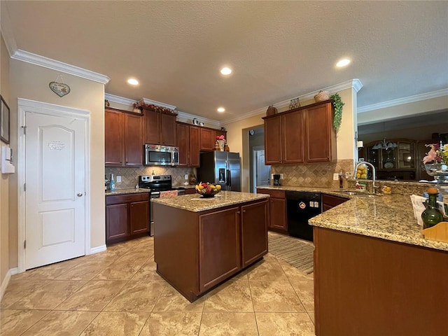 1820 Trophy Bass Way, Kissimmee, FL 34746 - kitchen with a sink, light stone counters, appliances with stainless steel finishes, and a center island