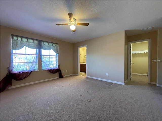 1820 Trophy Bass Way, Kissimmee, FL 34746 - unfurnished room featuring a textured ceiling, light colored carpet, baseboards, and ceiling fan