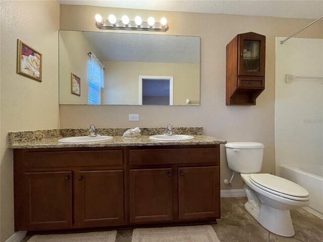 1820 Trophy Bass Way, Kissimmee, FL 34746 - full bath with a sink, toilet, double vanity, and a textured ceiling
