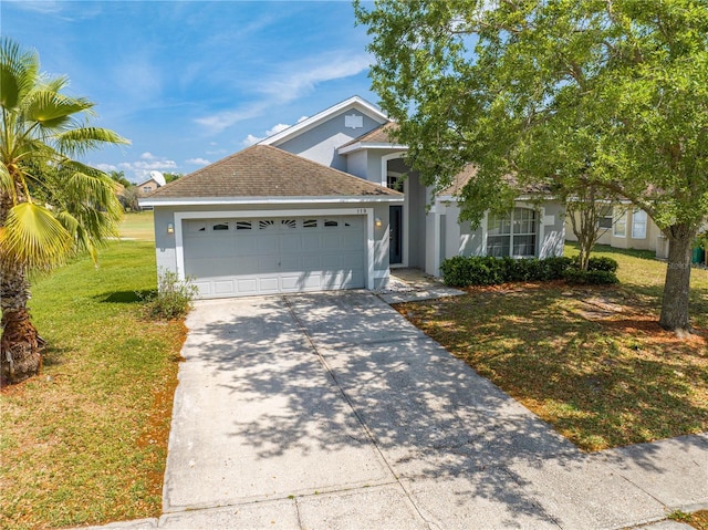 view of front of home featuring concrete driveway, stucco siding, roof with shingles, an attached garage, and a front lawn