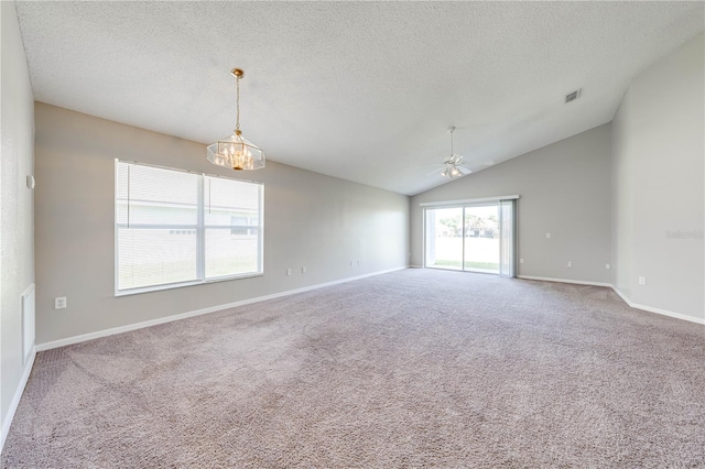 unfurnished room with a textured ceiling, visible vents, baseboards, ceiling fan with notable chandelier, and carpet floors