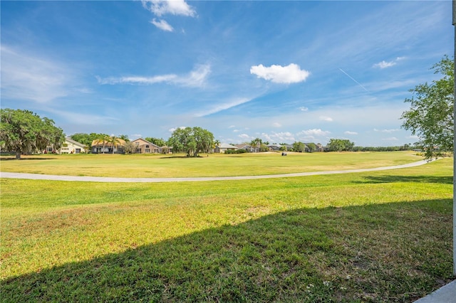 view of home's community with a lawn