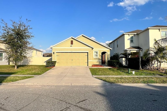 view of front of property featuring a garage and a front yard