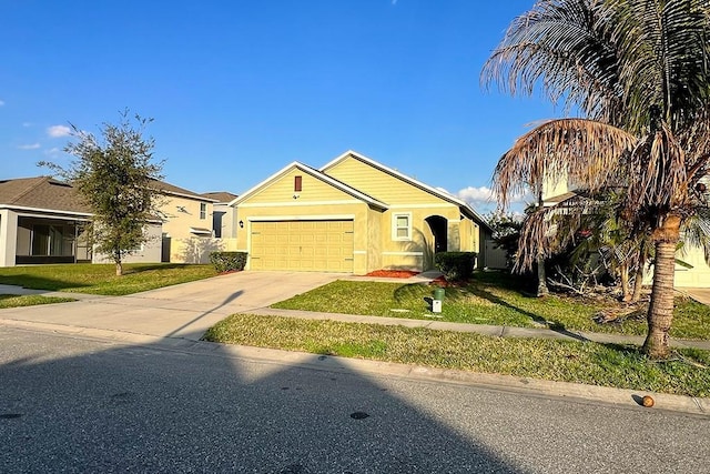 view of front facade featuring a garage and a front yard