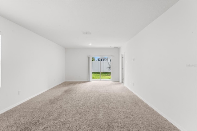 empty room with carpet flooring